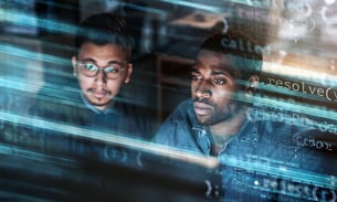 businessmen-working-with-code-overlay